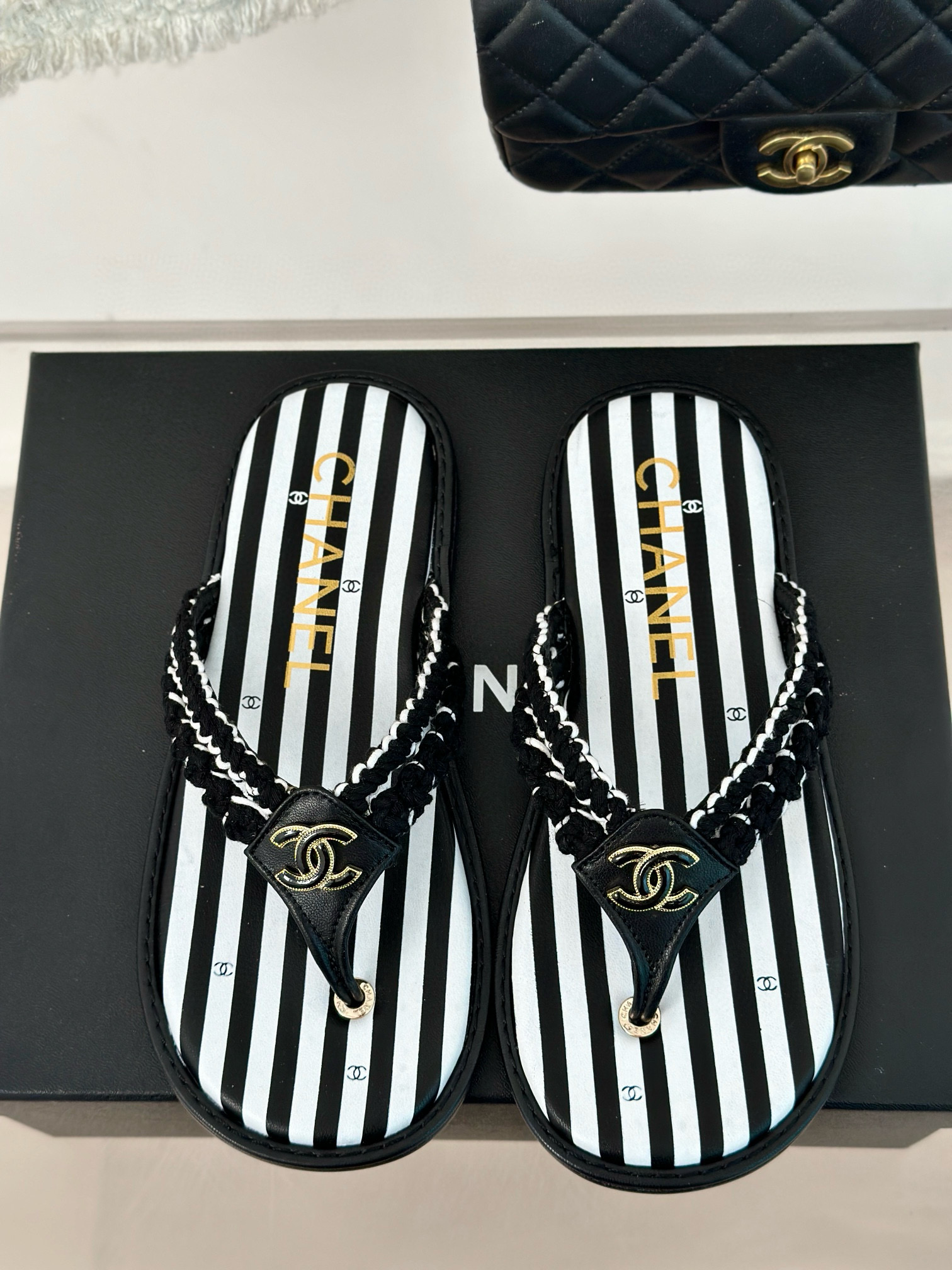 CHANEL Striped flip-flops