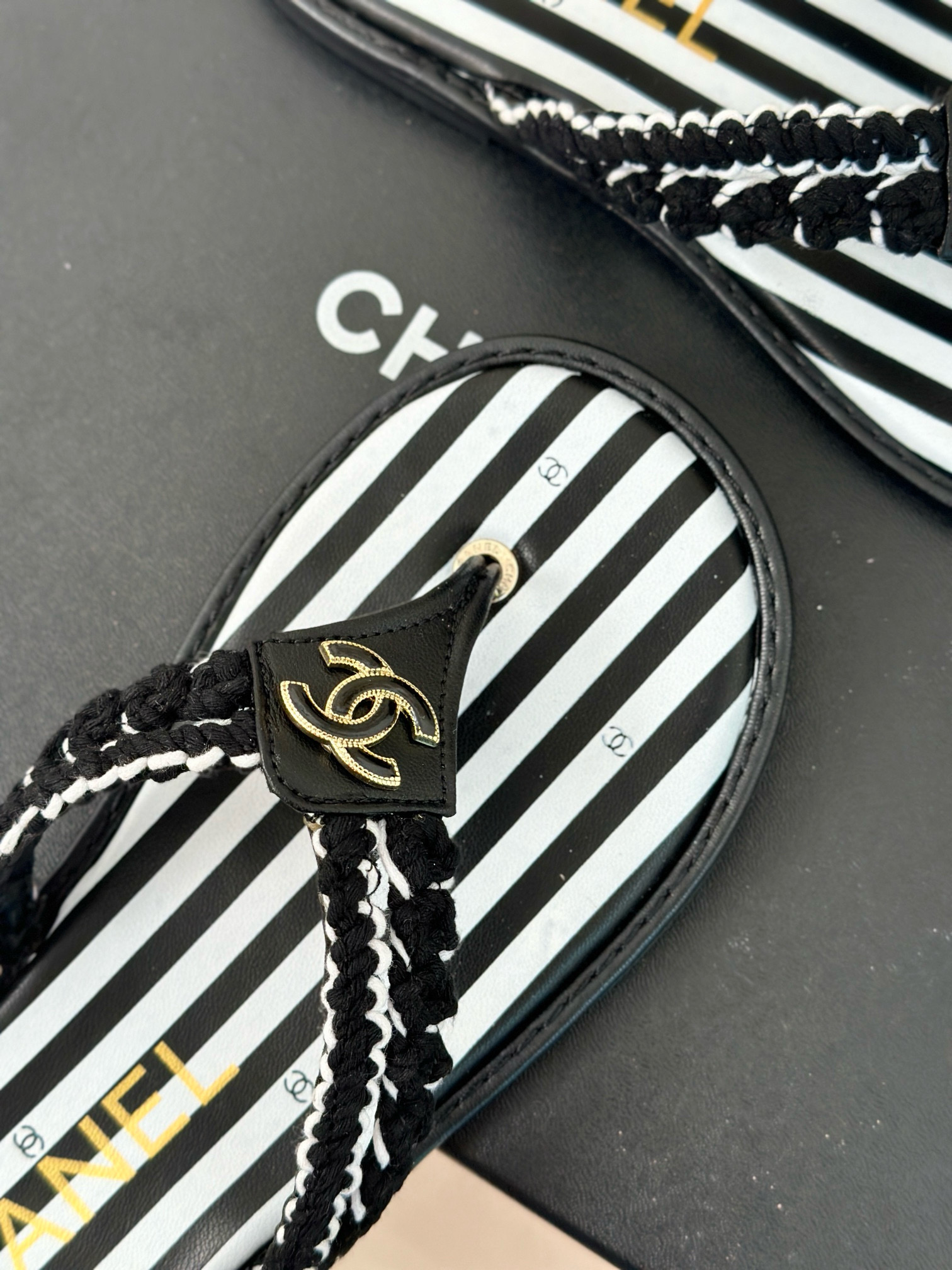 CHANEL Striped flip-flops