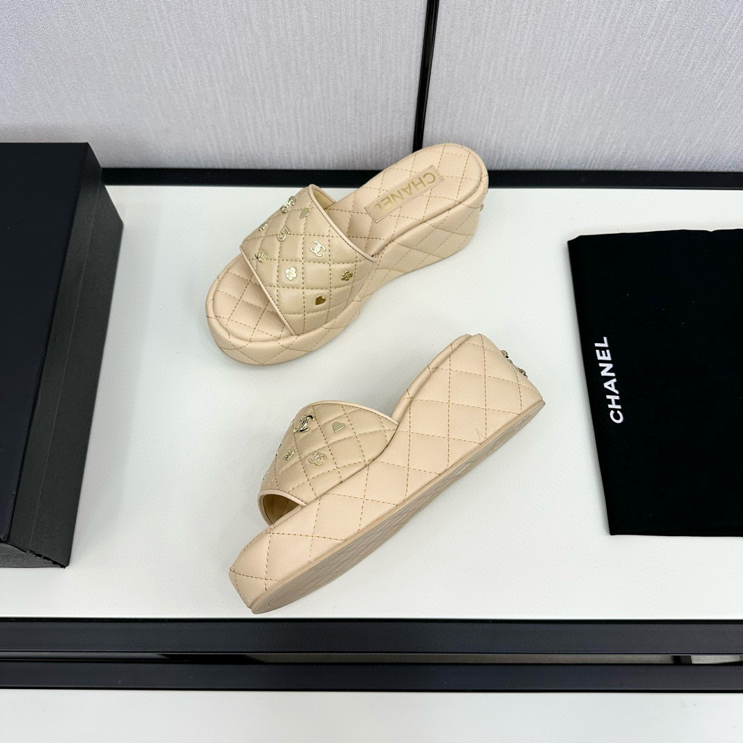 CHANEL hardware embroidered wedge slippers